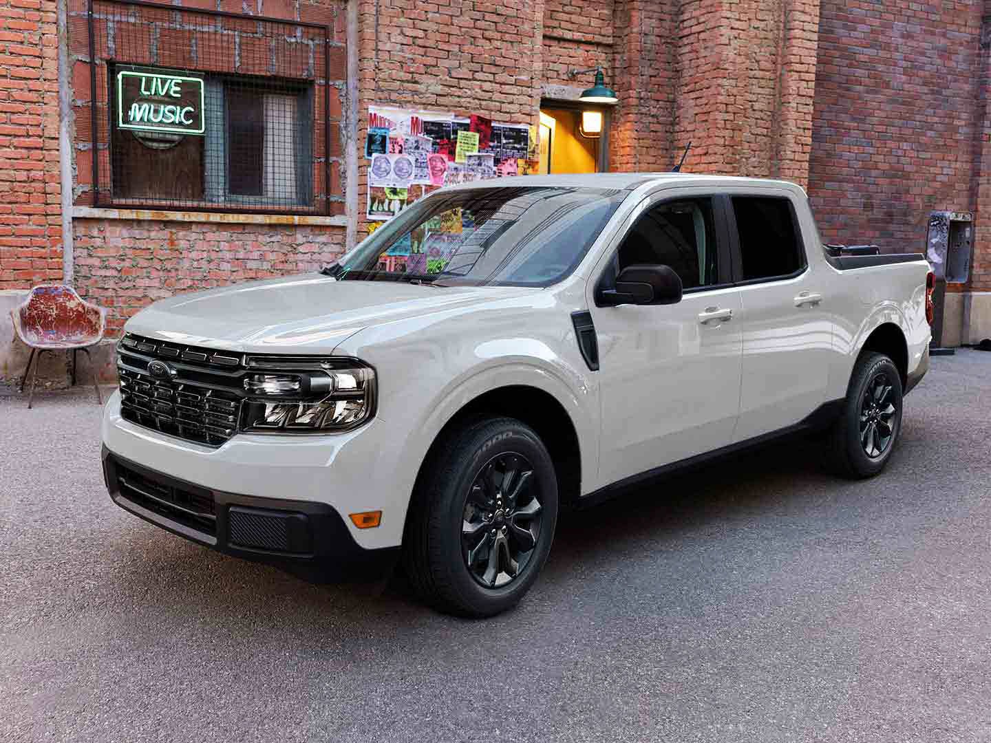 A Ford Maverick® parked in front of a small independent music store