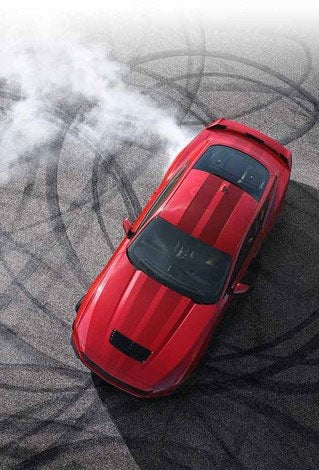 Overhead view of a 2024 Ford Mustang® model with tire tracks on pavement | Harlan Ford, Inc. in Okmulgee OK