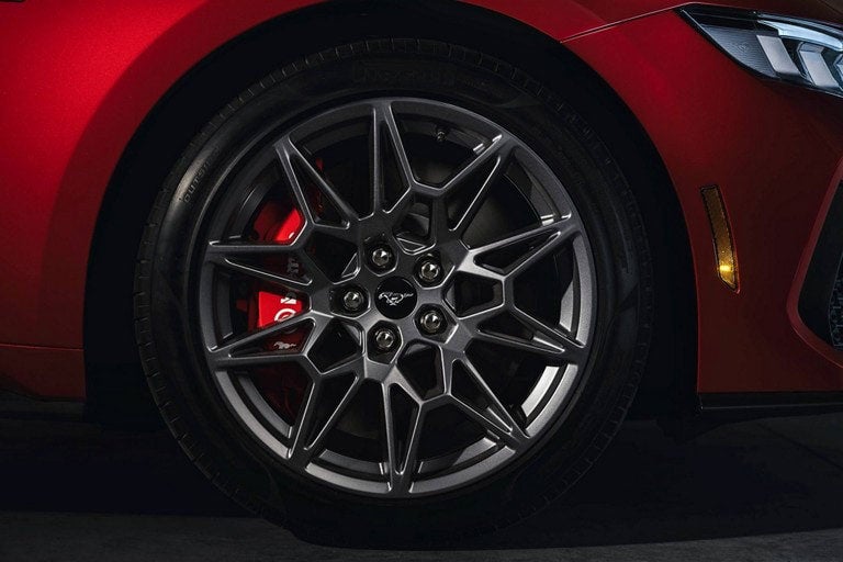 2024 Ford Mustang® model with a close-up of a wheel and brake caliper | Harlan Ford, Inc. in Okmulgee OK