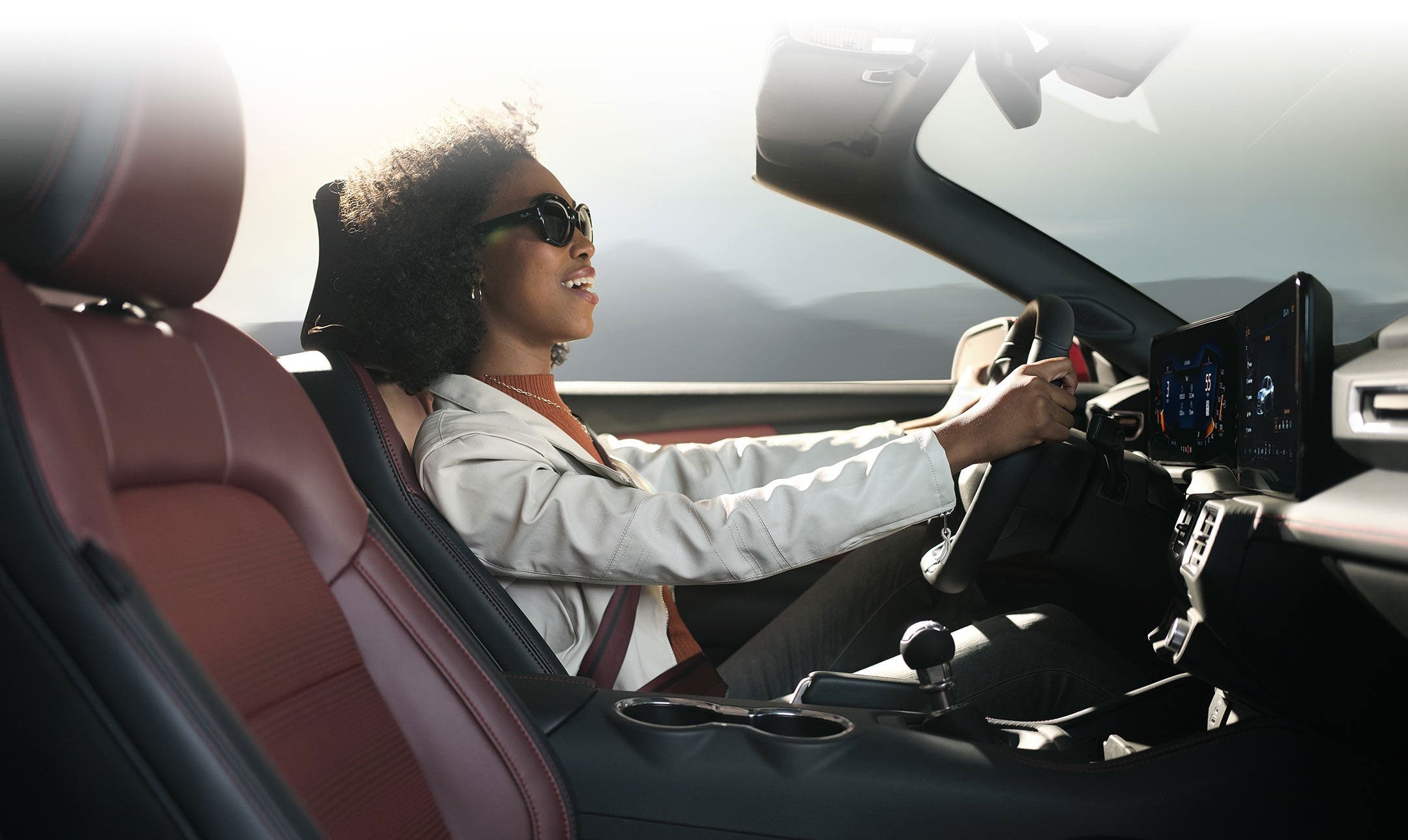 Person sitting in the driver’s seat of a 2024 Ford Mustang® convertible | Harlan Ford, Inc. in Okmulgee OK