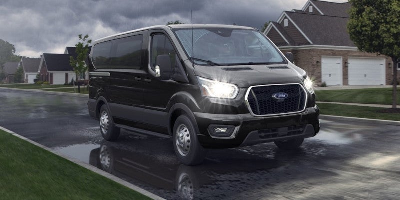 2025 Ford E-Transit Cargo Van driving in rain