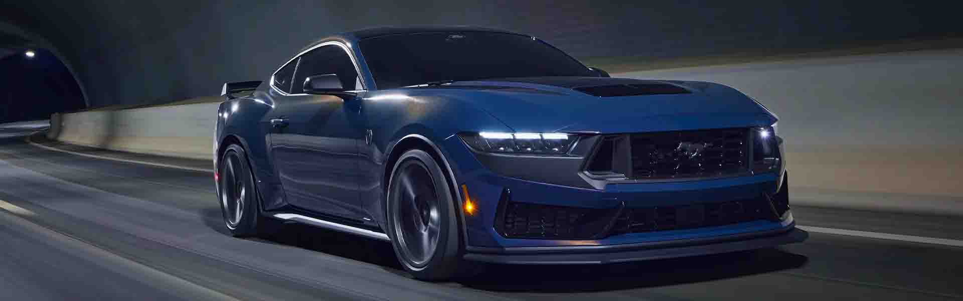 2025 Ford Mustang parked at night