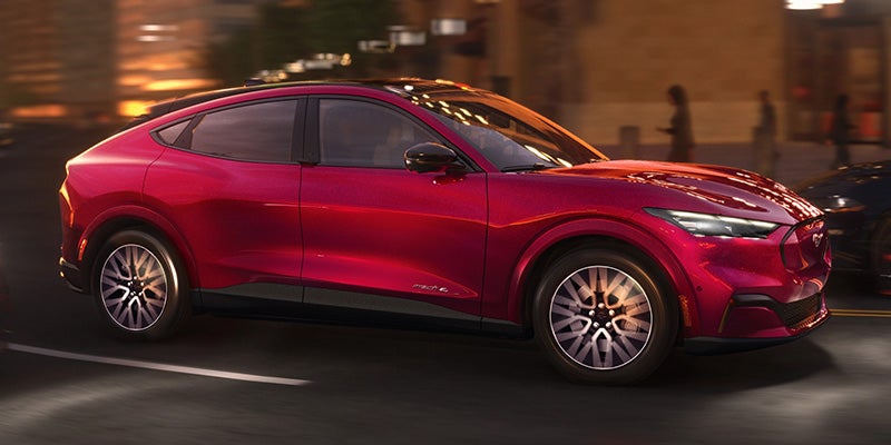 2025 Ford Mustang Mach-E driving on street at night