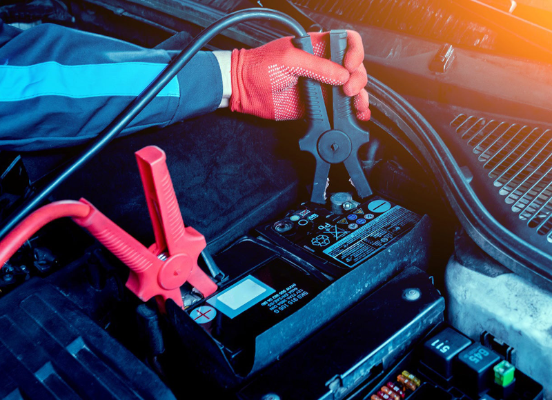 Car battery with jumper cables attached
